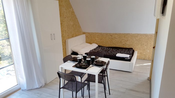 Hotel hel noclegiApartament czteroosobowy studio z balkonem.